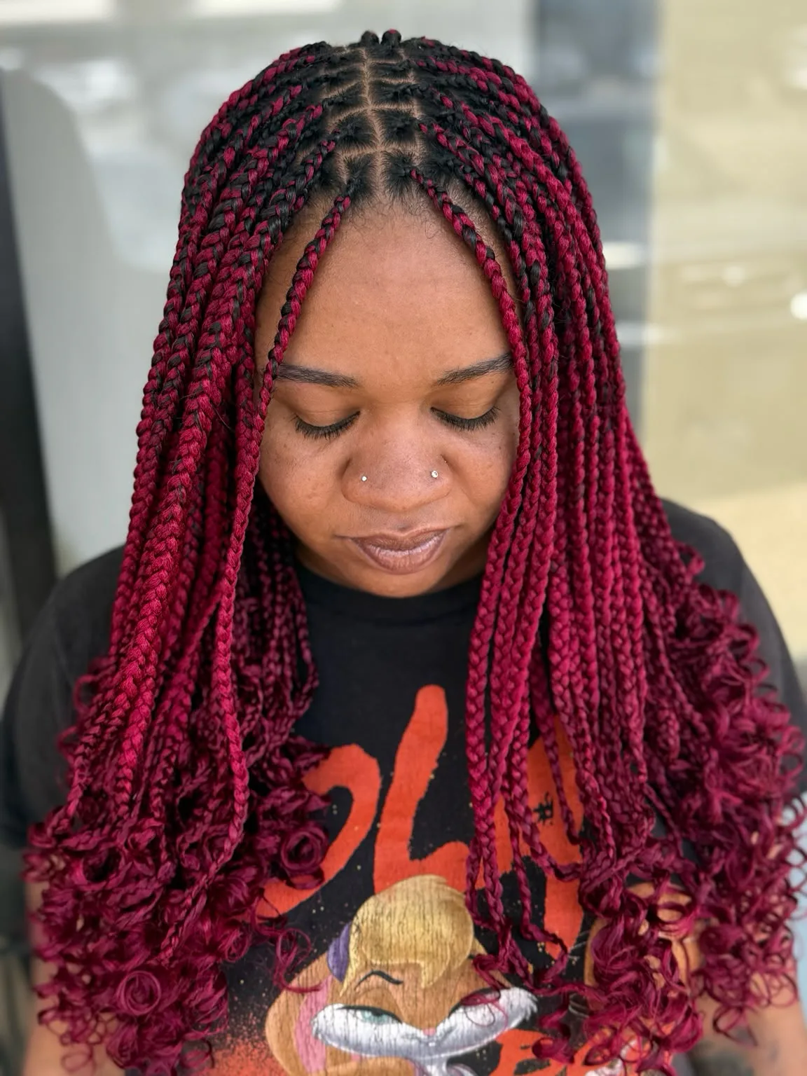 6-Medium-red-knotless-braids-with-soft-curly-ends-front-view
