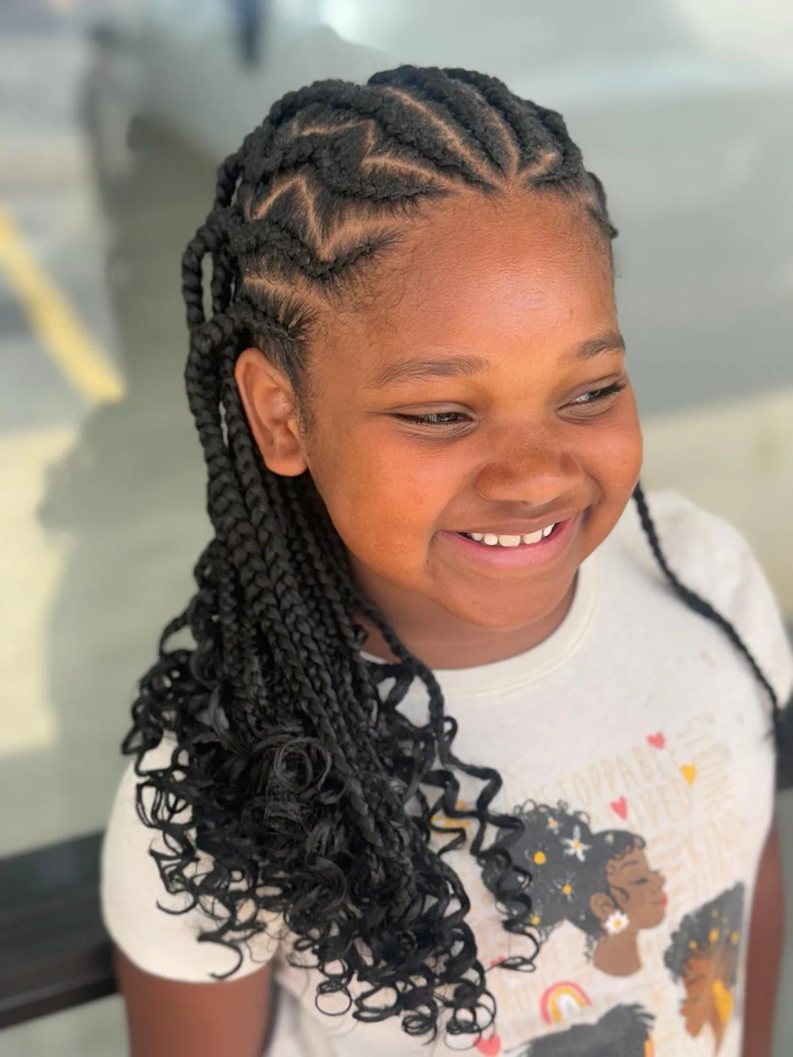 Black Medium Kids Stitch Braids with Curly Ends Front View2 by Pejah Braiding